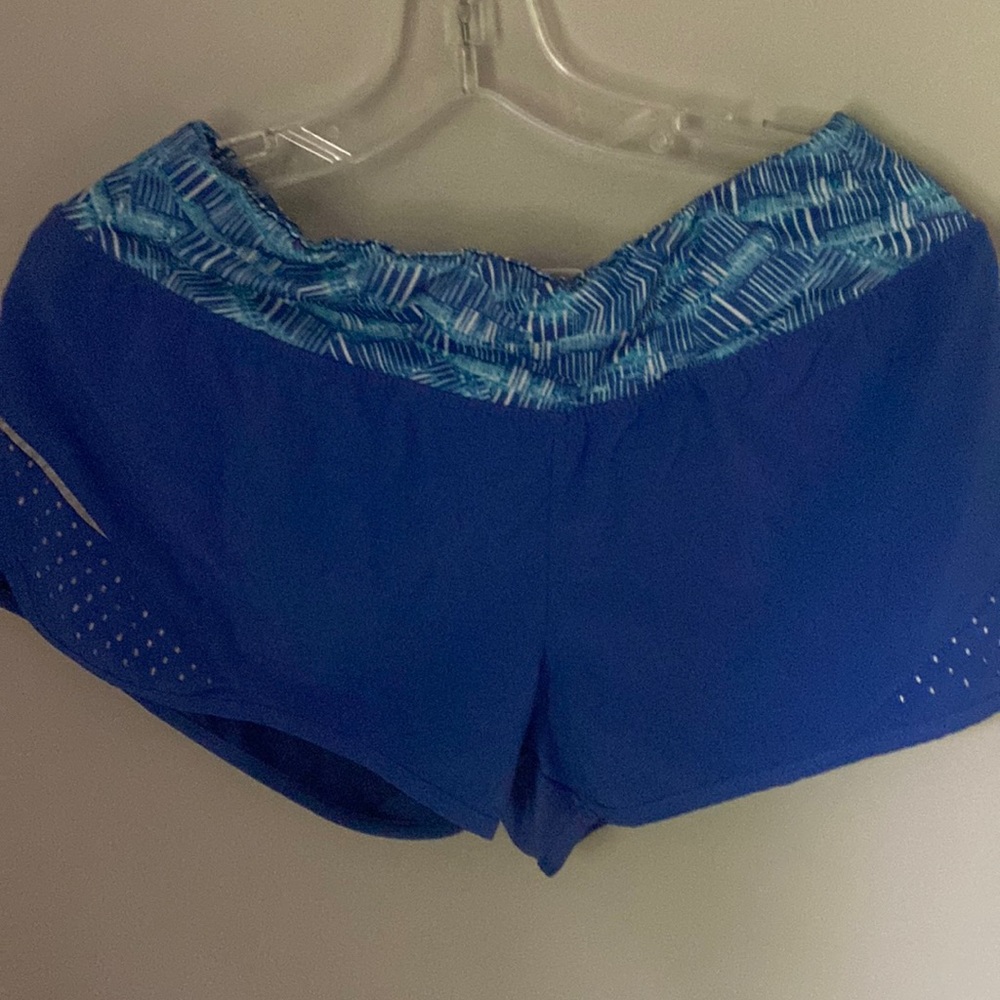 blue shorts with patterns at the top. very very comfortable reflected bottoms.